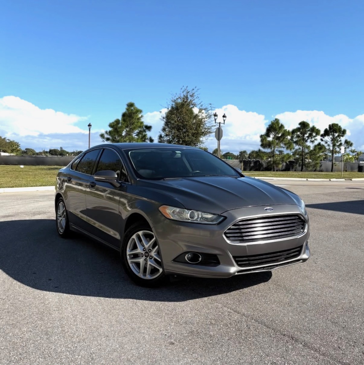 Gray Ford Fusion available from AceLux Services